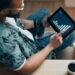 An investor uses a tablet
