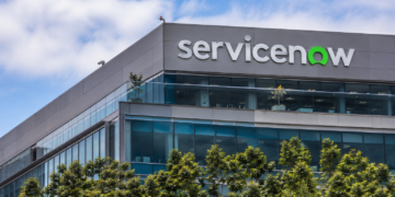 ServiceNow logo displayed on the exterior of a modern office building.