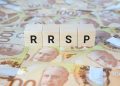 RRSP (Registered Retirement Savings Plan) on wooden blocks and Canadian one hundred dollar bills.