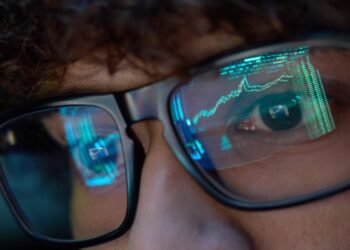 a person watches stock market trades