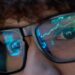 a person watches stock market trades