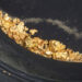 panning for gold uncovers nuggets and flakes