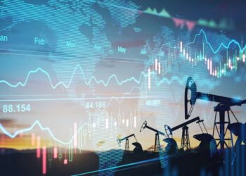 financial chart graphs and oil pumps on a field