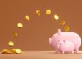 coins jump into piggy bank