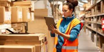 warehouse worker takes inventory in storage room