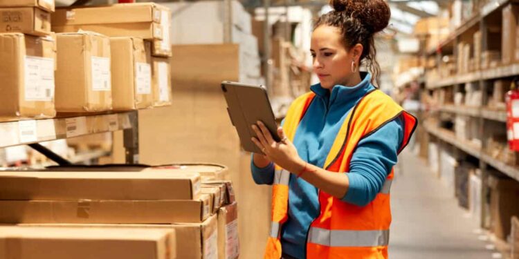 warehouse worker takes inventory in storage room