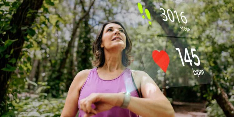runner checks her biodata on smartwatch