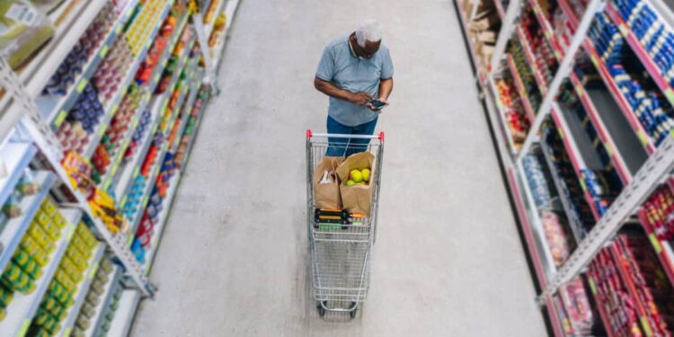 man shops at grocery store