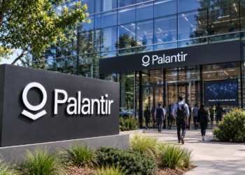 Palantir office exterior with the company’s name displayed prominently on a modern corporate building.