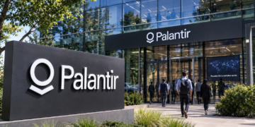 Palantir office exterior with the company’s name displayed prominently on a modern corporate building.