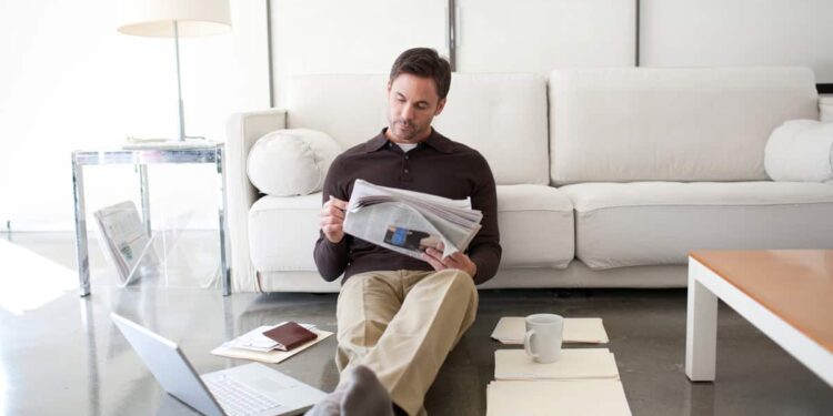 Investor reading the newspaper