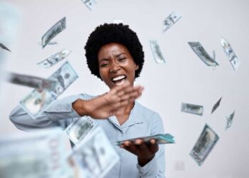 happy woman throws cash