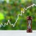 Hourglass and stock price chart