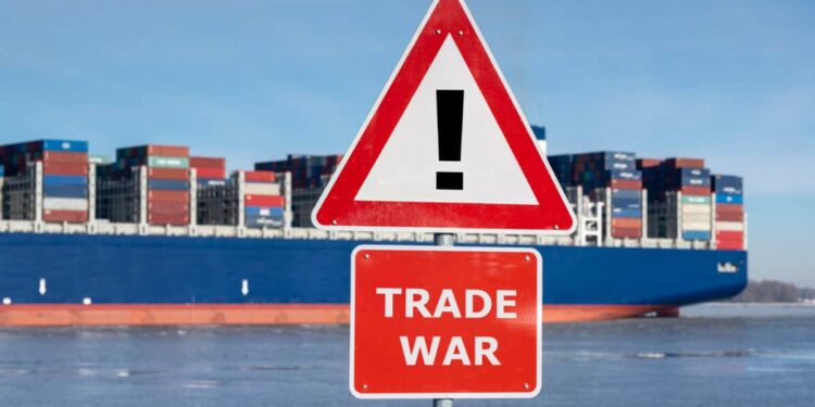 Warning sign with the text "Trade war" in front of container ship